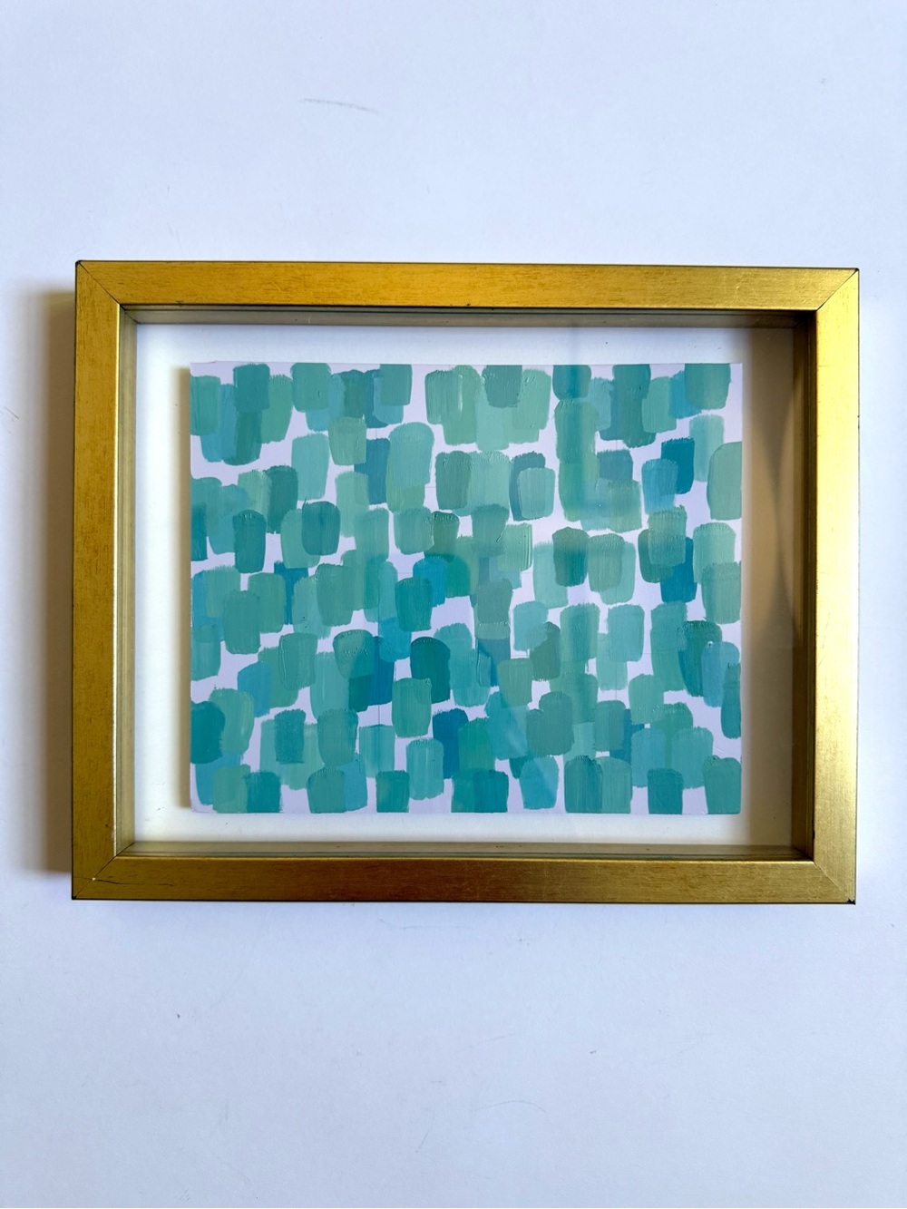 Tiffany blue artwork in gold frame